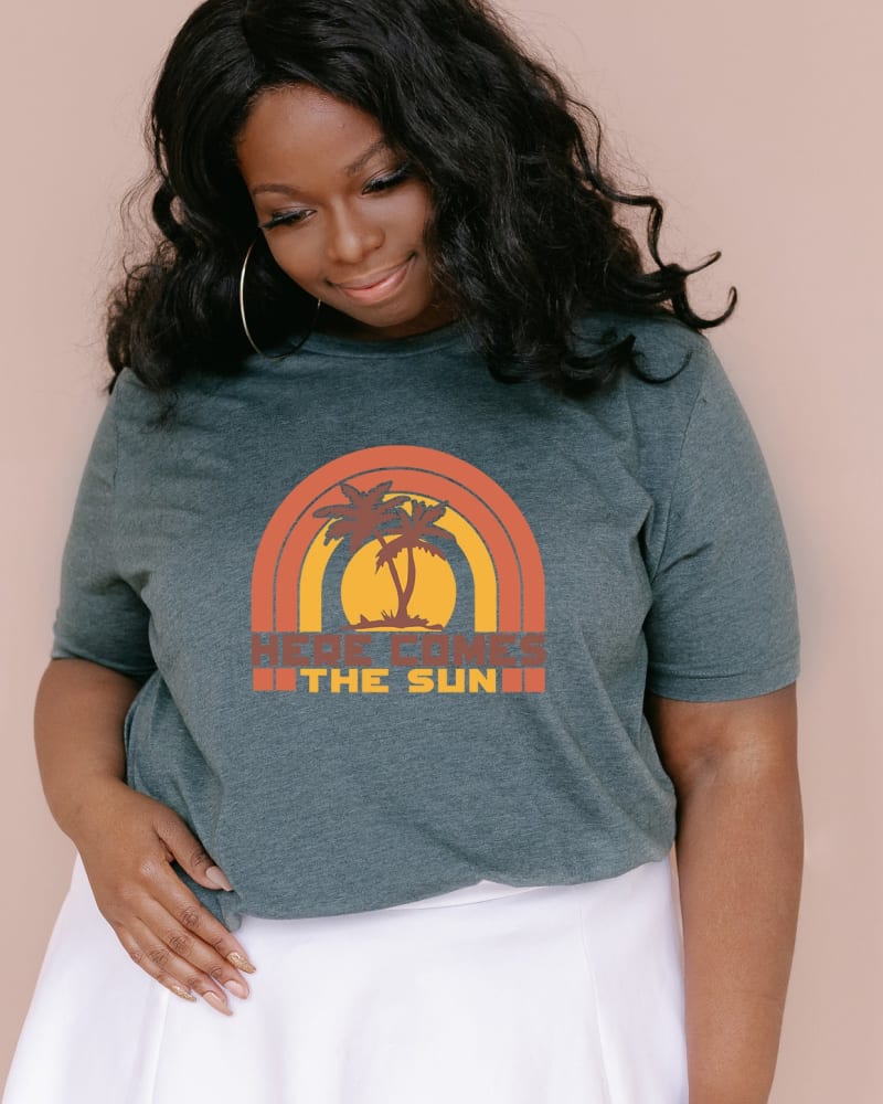 Front of a model wearing a size L Here Comes The Sun Rainbow l Short Sleeve Graphic Tee in Forest by Simply Sage Market. | dia_product_style_image_id:283734